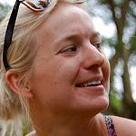 Detained Australian aid worker returns home