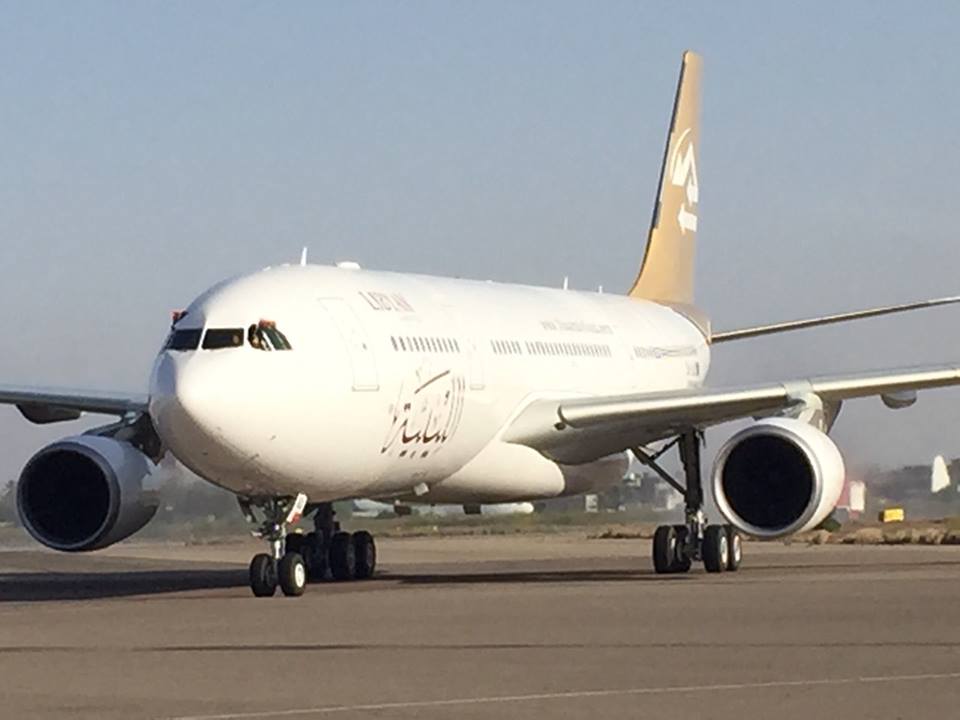 A new Libyan plane flies in as an old one flies out